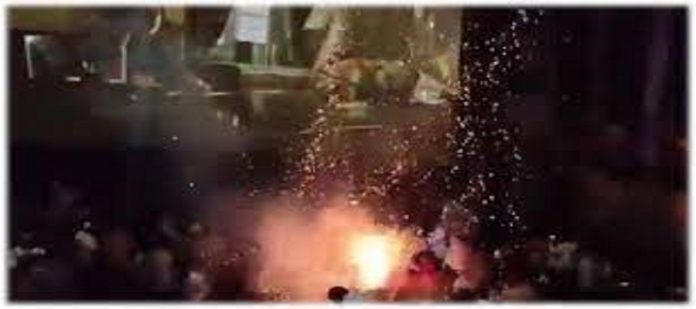 Bursting crackers in cinema hall